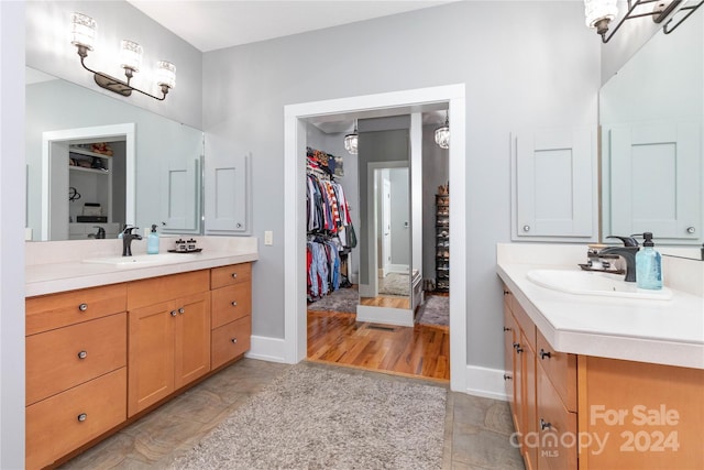 bathroom with hardwood / wood-style flooring and vanity