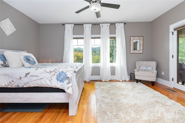 bedroom featuring light hardwood / wood-style flooring and ceiling fan