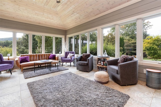 sunroom / solarium with wood ceiling, lofted ceiling, and plenty of natural light