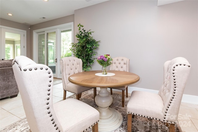 dining space with light tile patterned floors