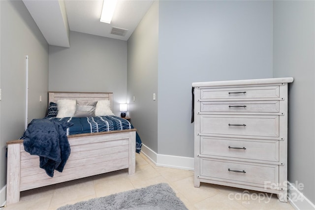 bedroom featuring light tile patterned floors