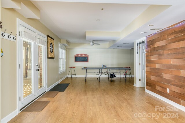 interior space with light wood-type flooring and ceiling fan