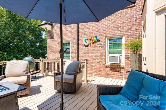 wooden terrace featuring outdoor lounge area