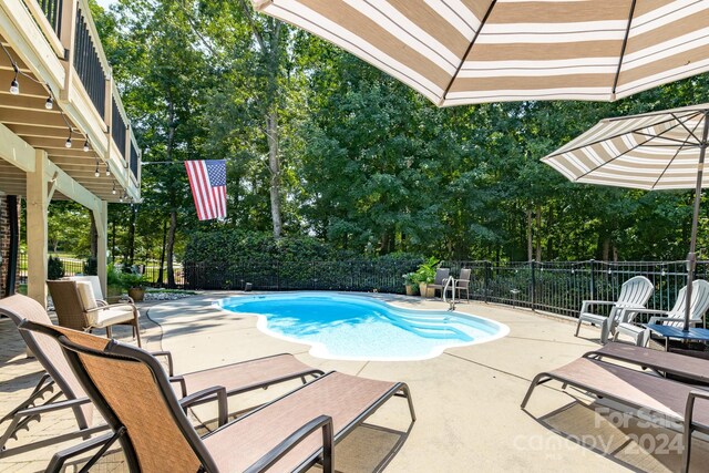 view of swimming pool featuring a patio