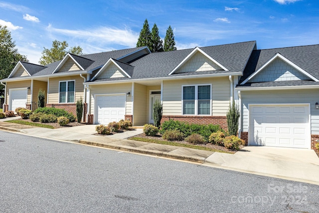 202 Ivy Ct, Morganton, NC 28655 - view of front of property with driveway, a garage, brick siding, and a shingled roof