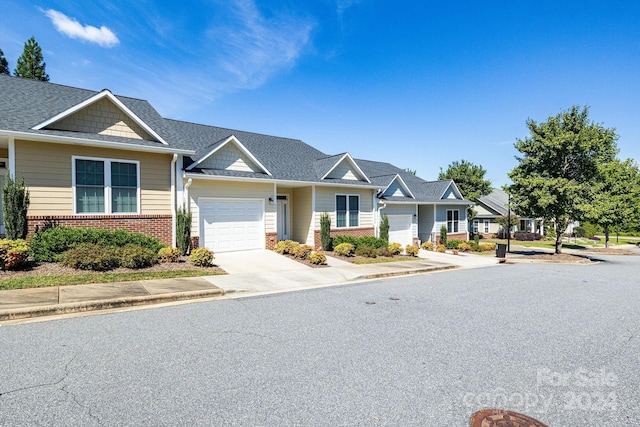 202 Ivy Ct, Morganton, NC 28655 - view of front of property with an attached garage, brick siding, concrete driveway, and a shingled roof