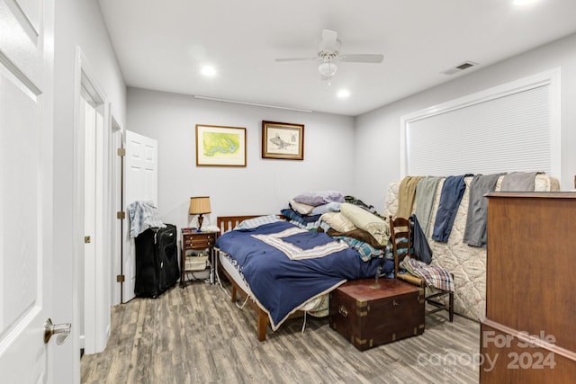 bedroom featuring ceiling fan and wood-type flooring