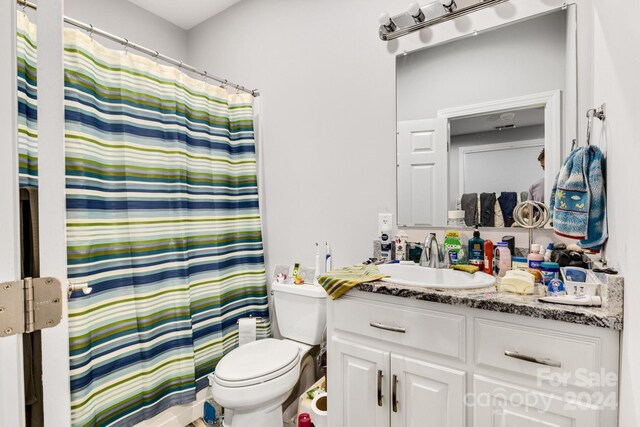 202 Ivy Ct, Morganton, NC 28655 - bathroom featuring vanity, toilet, and curtained shower