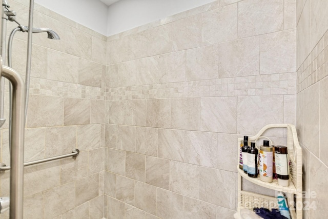 bathroom featuring a shower with door