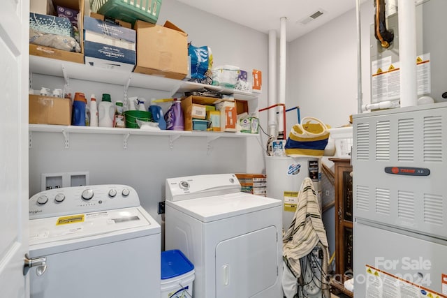 washroom featuring washing machine and dryer