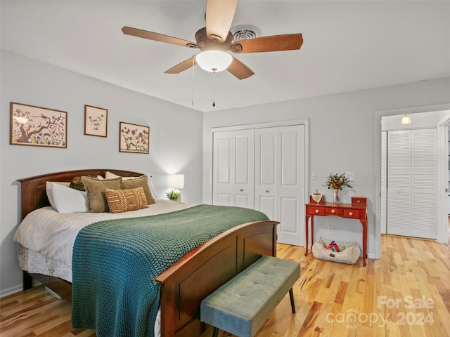 bedroom featuring light wood-type flooring, a closet, and ceiling fan