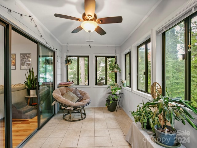 sunroom / solarium with plenty of natural light and ceiling fan