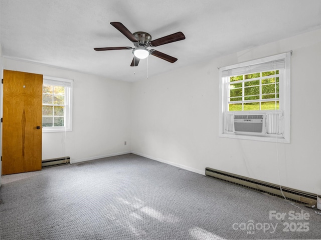 unfurnished room with a healthy amount of sunlight, cooling unit, and a baseboard radiator