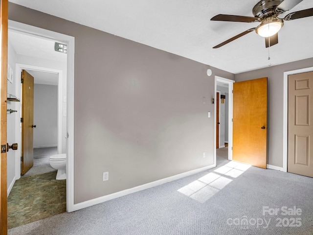 unfurnished bedroom with ensuite bathroom, ceiling fan, and light colored carpet