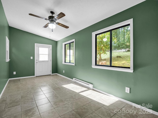 unfurnished room with ceiling fan, lofted ceiling, light tile patterned floors, and a baseboard radiator