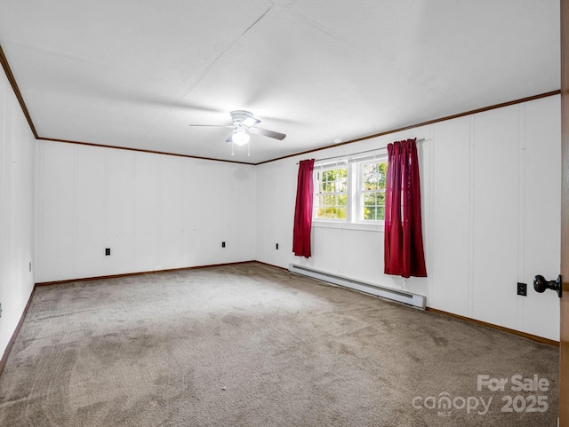 carpeted empty room with ceiling fan, crown molding, and a baseboard radiator