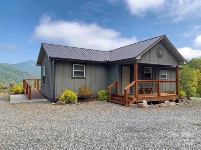 view of front of property featuring a mountain view and a porch