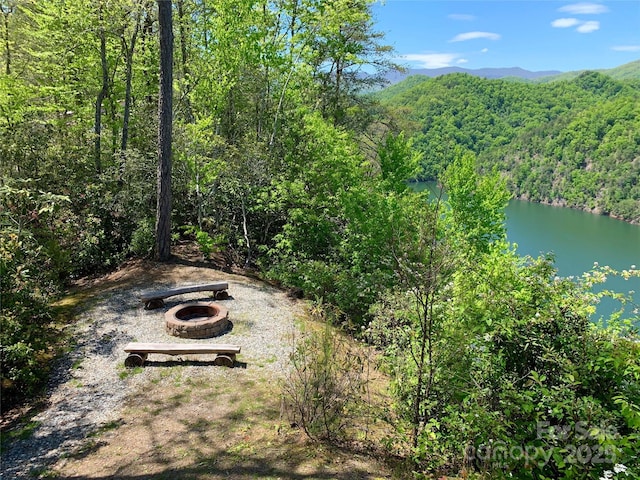 bird's eye view with a water and mountain view