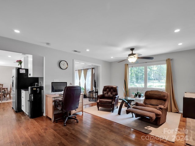 office space with hardwood / wood-style floors and ceiling fan