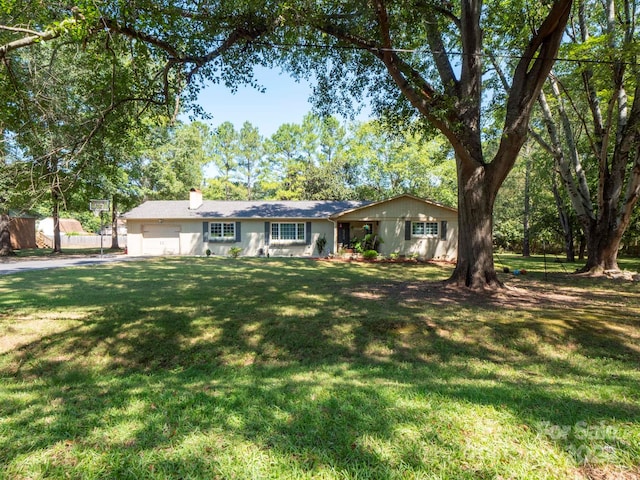 ranch-style house with a front lawn