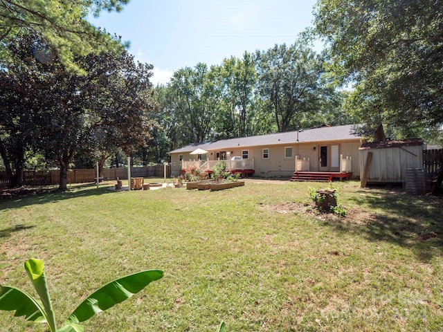 view of yard featuring a wooden deck