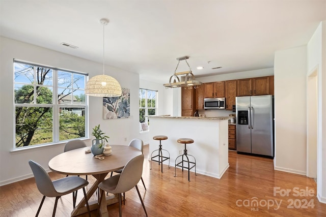 dining area with light hardwood / wood-style flooring