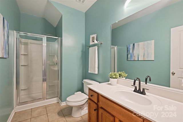 bathroom with tile patterned flooring, walk in shower, toilet, and vanity