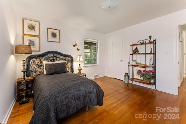 bedroom featuring wood-type flooring