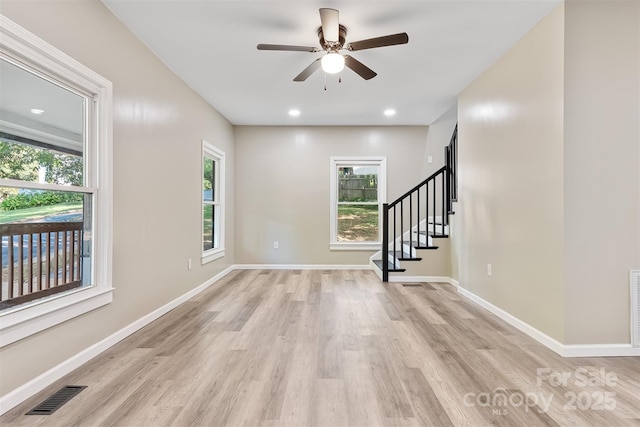 interior space with ceiling fan and light wood-type flooring