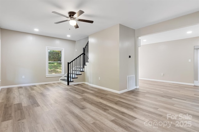 unfurnished room featuring light hardwood / wood-style flooring and ceiling fan