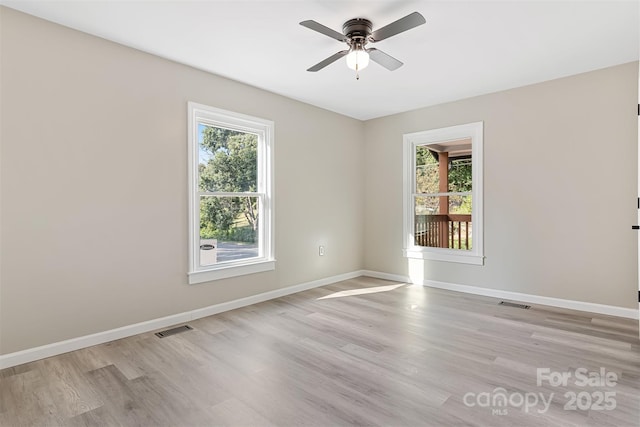 empty room featuring ceiling fan and light hardwood / wood-style flooring