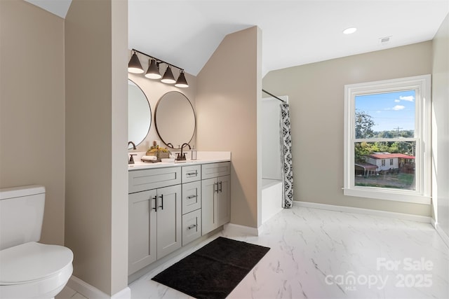 full bathroom featuring vanity, toilet, and shower / bath combo