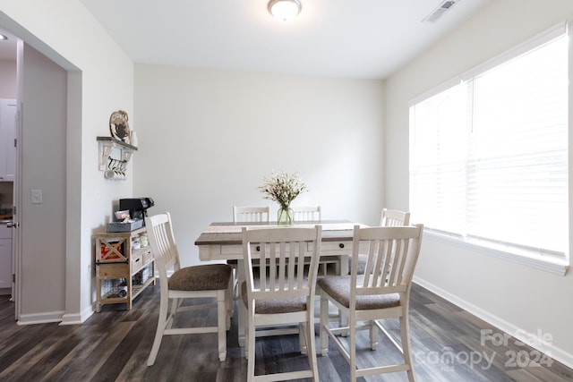 dining room with dark wood-type flooring