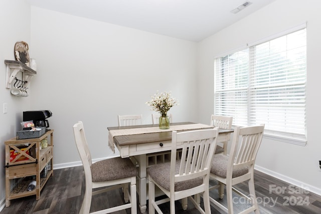 dining area featuring dark hardwood / wood-style flooring