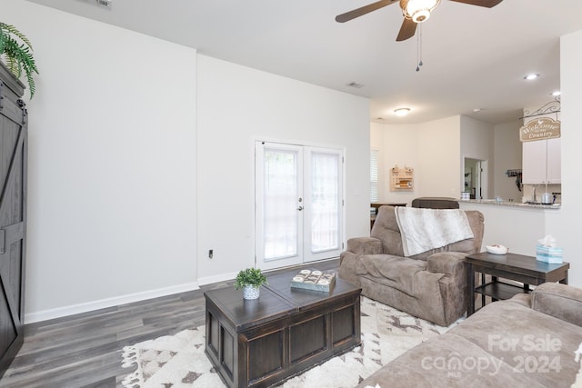 living room with french doors, hardwood / wood-style floors, and ceiling fan