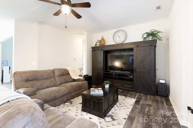 living room with ceiling fan and wood-type flooring