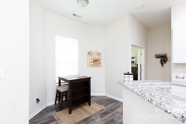 dining area featuring dark hardwood / wood-style floors and sink