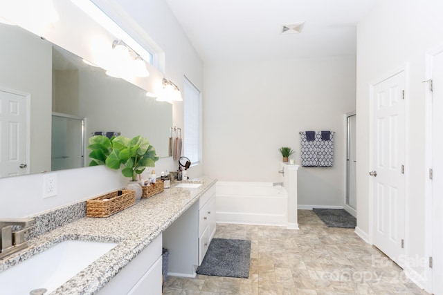 bathroom with separate shower and tub and vanity