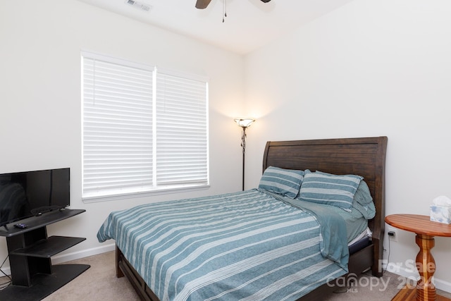 bedroom featuring ceiling fan and carpet