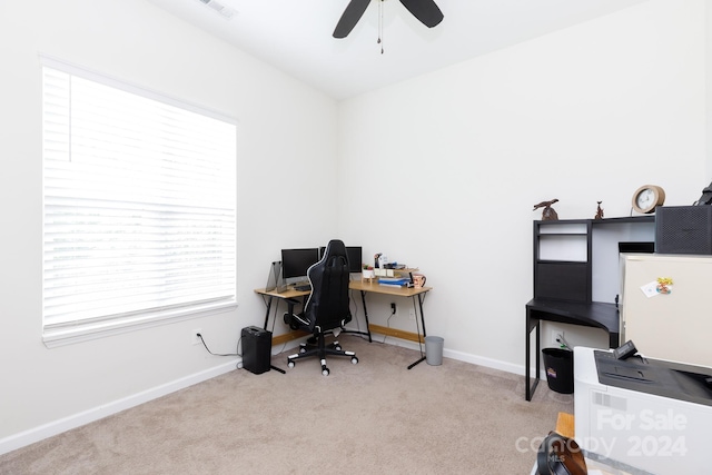 office area with ceiling fan and light carpet