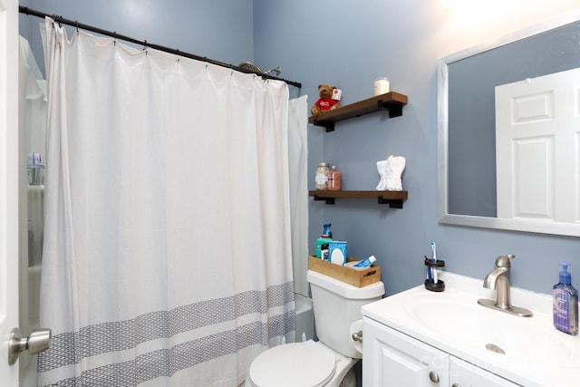 full bathroom featuring toilet, shower with separate bathtub, and vanity