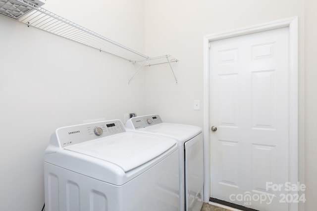 laundry area featuring washing machine and dryer