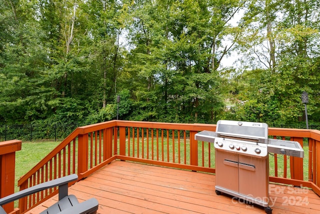 wooden deck featuring area for grilling