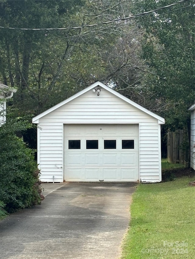 garage with a lawn