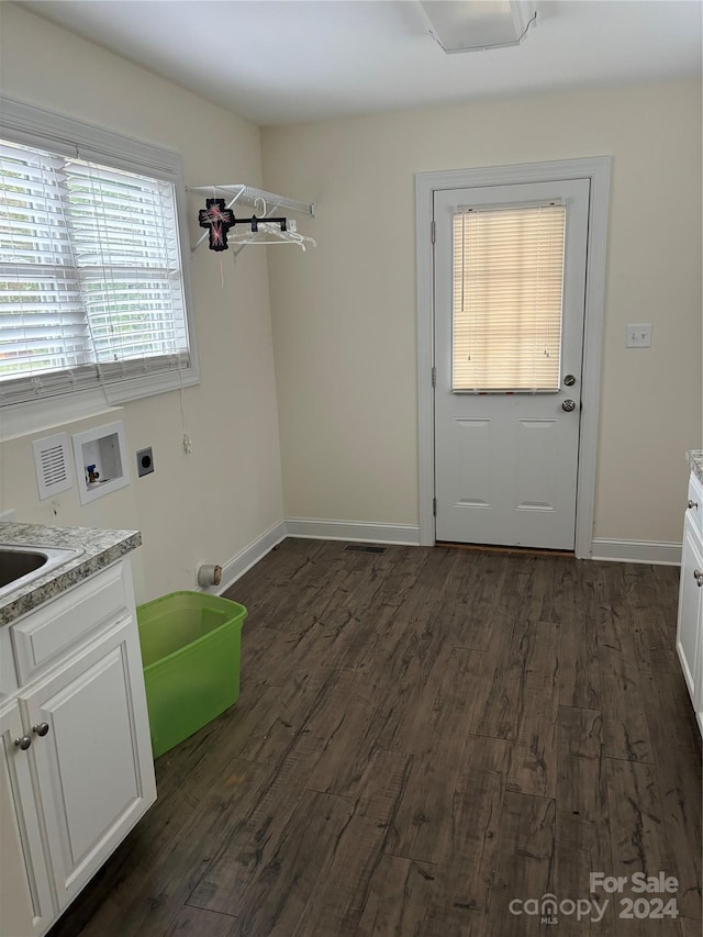 laundry room featuring washer hookup, electric dryer hookup, cabinets, dark hardwood / wood-style floors, and sink