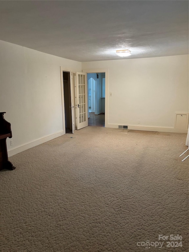 spare room with carpet floors