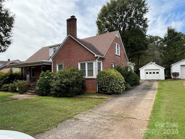 view of home's exterior featuring a lawn, an outdoor structure, and a garage