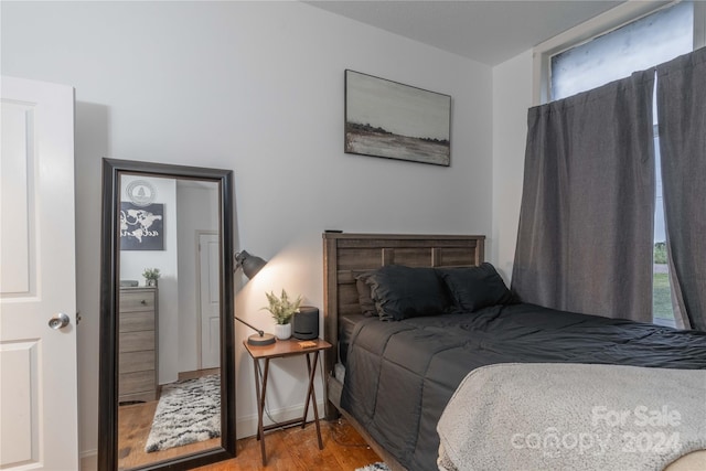 bedroom with light hardwood / wood-style floors