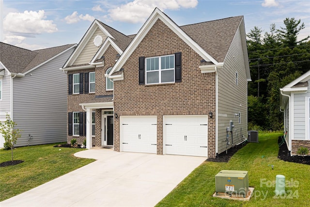 craftsman-style home featuring central AC, a garage, and a front lawn