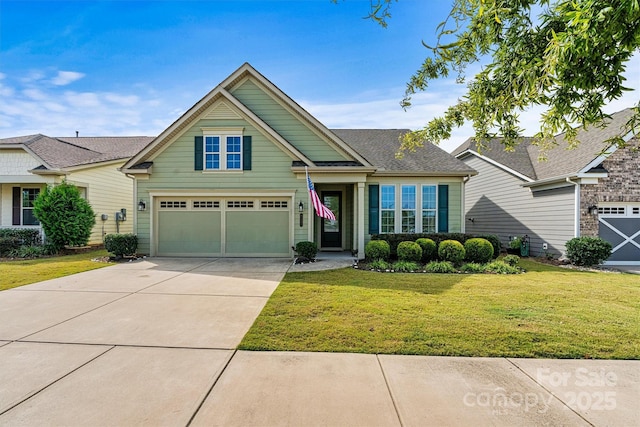 view of front of property featuring a front lawn, a garage, driveway, and a shingled roof